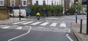 Zebra crossing on flat-topped hump by junction